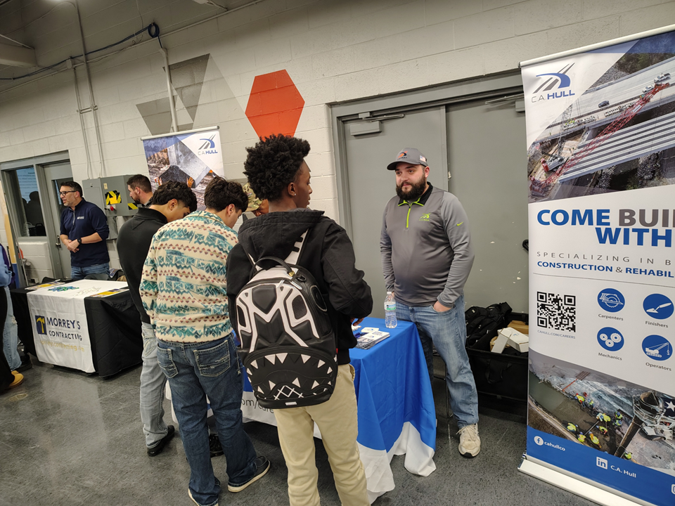  Student talking with employer at Construction Trades 101